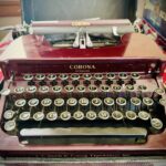 A maroon manual typewriter